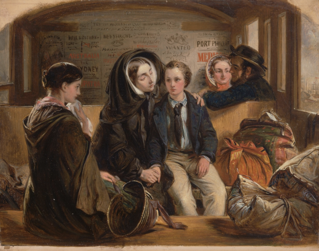 A group of 5 people are sat in a train carriage, a woman is looking at her son. 
